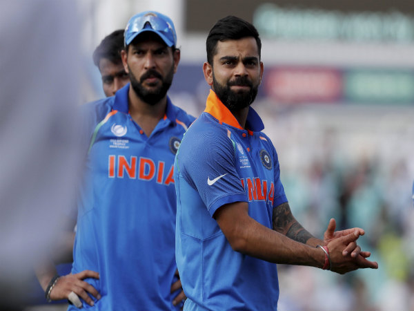 Virat Kohli (front) with Indian team after the final.
