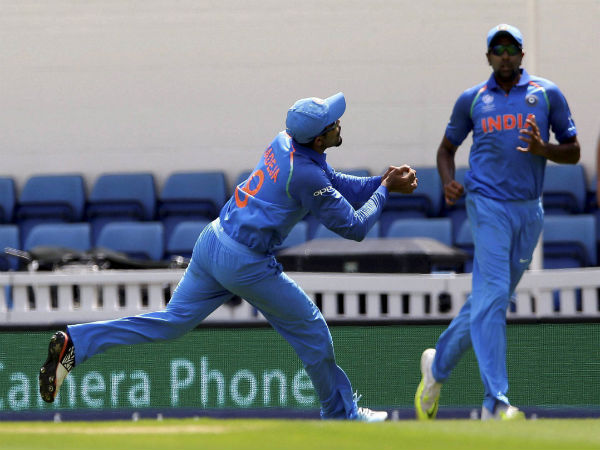 Ravindra Jadeja (left) takes Fakhar Zaman's catch