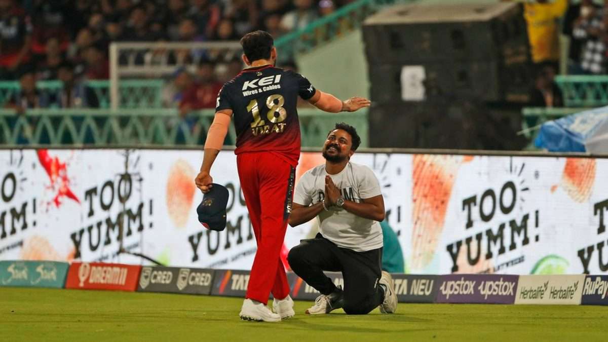 IPL 2023: Virat Kohli hugs intruding Fan in Lucknow, Fan touches RCB  captain's feet - myKhel