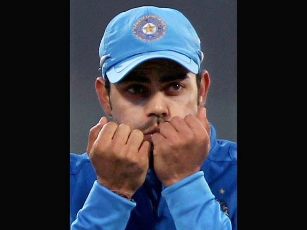 Kohli warms his cold hands