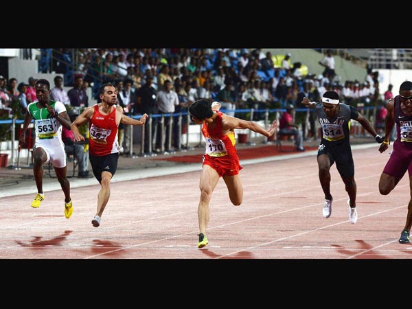 Su Bingtain of China wins 100m race