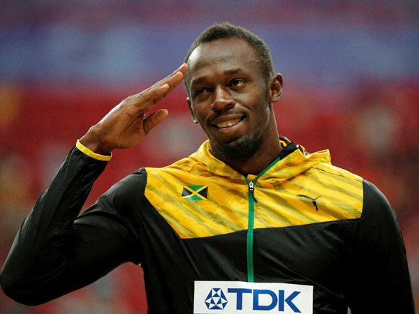Jamaica's Usain Bolt gestures on the podium