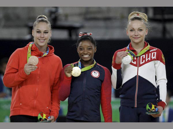 From left: Giulia Steingruber, bronze, Simone Biles, gold, and Maria Paseka, silver