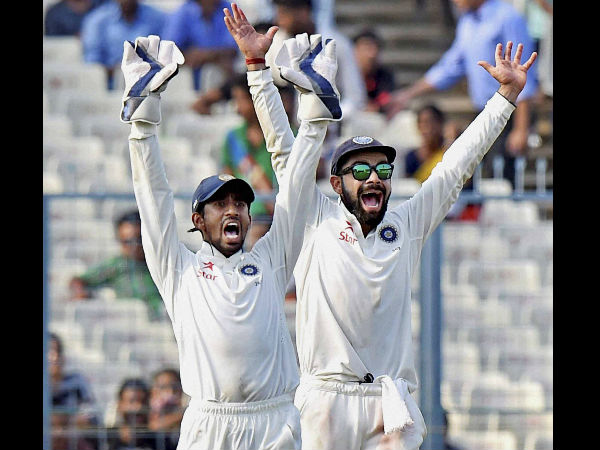 Kohli and Saha appeal for a wicket