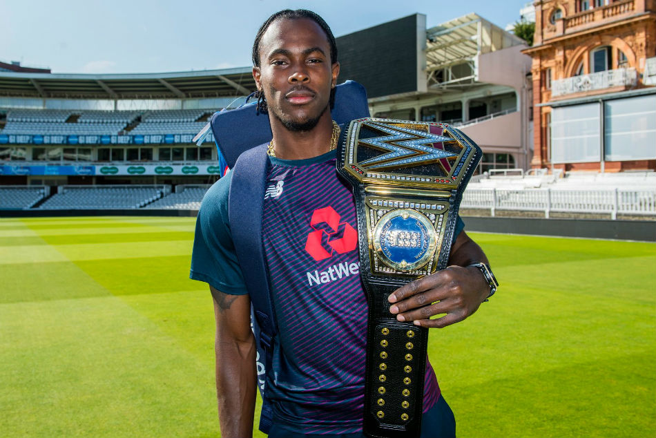 Archer poses with the title