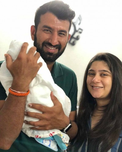 Cheteswhar Pujara along with his baby and wife