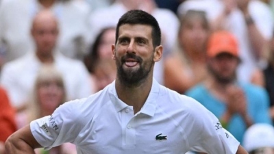 Djokovic celebrates Wimbledon ton